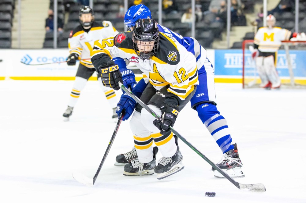 Courtesy Rob Wallator/WHL
Clarke Caswell of Team Manitoba fights for the puck against a Team B.C. player at the WHL Cup in October in Calgary. The Brandonite is widely expected to be a first-round pick in Thursday’s Western Hockey League draft.