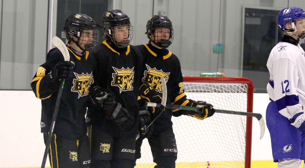 Perry Bergson/The Brandon Sun
Under-15 AAA Brandon Wheat Kings forward Cole Temple (16, left), Colten Worthington (8, centre) and Loughlan McMullan (22, right) celebrate a goal against the Interlake Lightning at the newly opened J&G Homes Arena on Dec. 4, 2021 in a 13-1 victory.