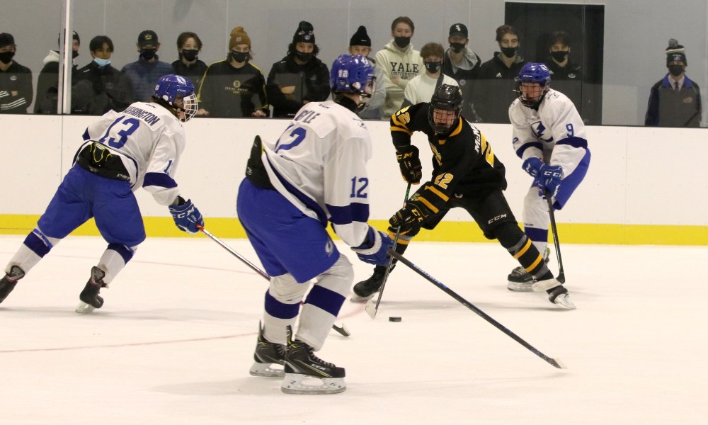 Perry Bergson/The Brandon Sun
Under-15 AAA Brandon Wheat Kings forward Loughlan McMullan (22) works against Interlake Lightning defenders Skylar Farrington (13), Wade Byle (12) and Cole Swanson (9) at J&G Homes Arena on Dec. 4, 2021 in a 13-1 victory.