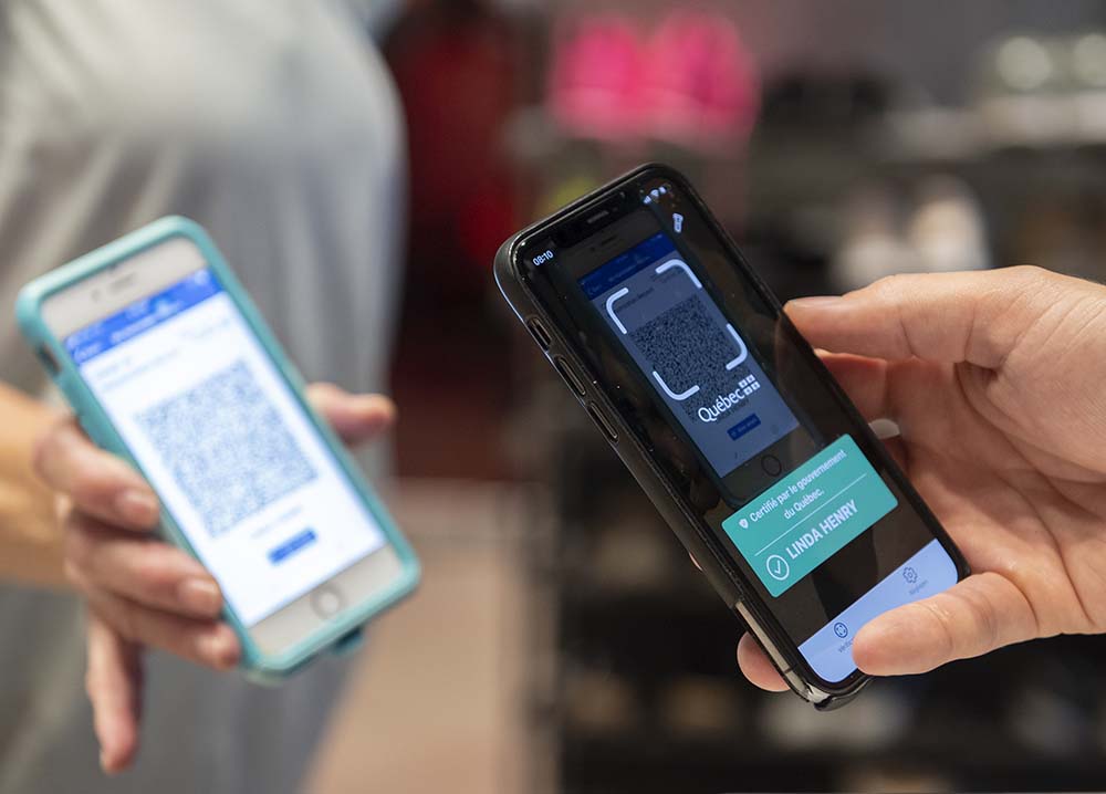 The Canadian Press
A person scans a COVID-19 QR code in Montreal. Vaccine passports are a measure provinces have introduced to verify a person's COVID-19 vaccination status to unlock certain privileges.