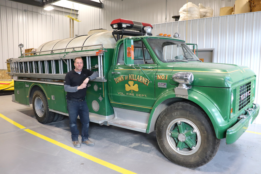 Deputy fire chief Sean Phillips poses for a photo next to a modified 1967 GMC 960 truck on Wednesday evening. The vehicle has been a part of the Killarney-Turtle Mountain Fire Department’s fleet for over 50 years and is facing retirement in the not-too-distant future. (Kyle Darbyson/The Brandon Sun)