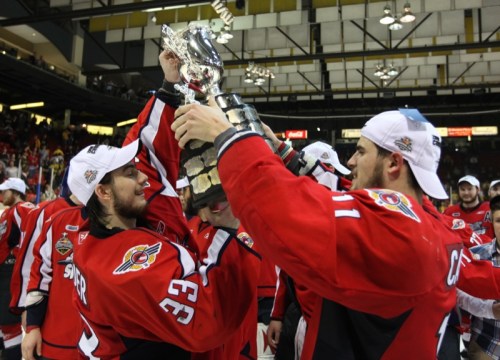 Tim Smith/Brandon Sun
Goalie Philipp Grubauer, left, of the Windsor Spitfires takes the Memorial Cup trophy from teammate Marc Cantin after the Spitfires won the 2010 MasterCard Memorial Cup 	at Westman Place Sunday night. The Spitfires beat the Brandon Wheat Kings 9-1.