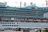 The cruise ship Diamond Princess is anchored at the Yokohama Port in Yokohama, near Tokyo Friday, Feb. 7, 2020. Japan on Friday reported 41 new cases of a virus on a cruise ship that's been quarantined in Yokohama harbor while the death toll in mainland China rose to 636, including a doctor who got in trouble with authorities in the communist country for sounding an early warning about the disease threat. (AP Photo/Eugene Hoshiko)