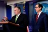 Treasury Secretary Steven Mnuchin, right, and Secretary of State Mike Pompeo, left, speak during a briefing at the White House in Washington, Friday, Jan. 10, 2020. (AP Photo/Susan Walsh)