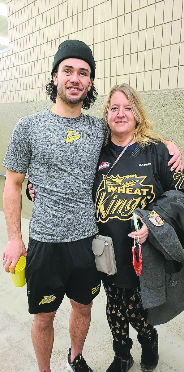 Submitted
Brandon Wheat Kings forward Landon Roberts poses with his former Tri-City Americans billet Tracy Wilson, who spent last week visiting Manitoba.