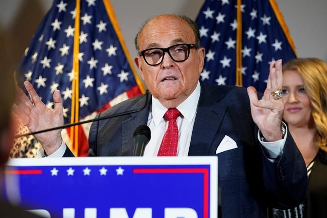 FILE - In this Nov. 19, 2020, file photo, former New York Mayor Rudy Giuliani, a lawyer for President Donald Trump, speaks during a news conference at the Republican National Committee headquarters, in Washington. Giuliani urged Michigan Republican activists on Wednesday, Nov. 2, 2020, to pressure the GOP-controlled Legislature to