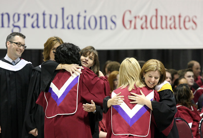 Bruce Bumstead/Brandon Sun
Graduates receive hugs from their instructors after receiving their diplomas during ACC’s graduation ceremony held at Westman Place in the Keystone Centre June 3.