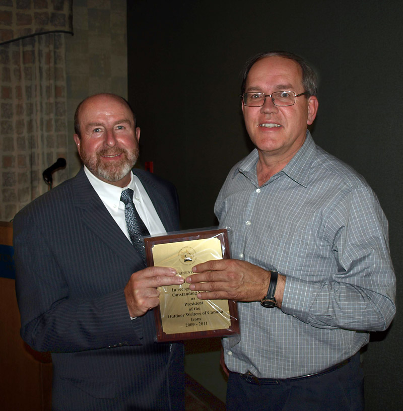 Submitted
Neepawa author Bill Stilwell (right) receives his award from a representative of the Outdoor Writers of Canada.