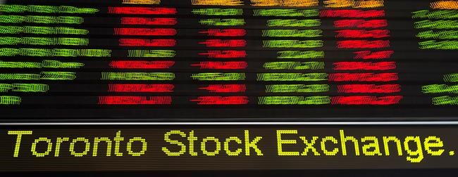 Financial numbers flow on the digital ticker tape at the TMX Group in Toronto's financial district on May 9, 2014. THE CANADIAN PRESS/Darren Calabrese