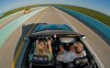 A couple rides in a convertible car, Wednesday, Sept. 28, 2011, near Key Largo, Fla., Canadians visiting Florida may be surprised to hear they now need an International Driving Permit to motor around the state. THE CANADIAN PRESS/AP-Florida Keys News Bureau, Andy Newman