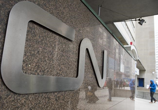 A man walks into central station next to CN headquarters in Montreal, Tuesday, Nov. 26, 2019. Canadian National Railway Co. says service is back to normal less than a month after a strike brought it to a screeching halt, but big grain backlogs remain a concern for Western farmers. THE CANADIAN PRESS/Graham Hughes