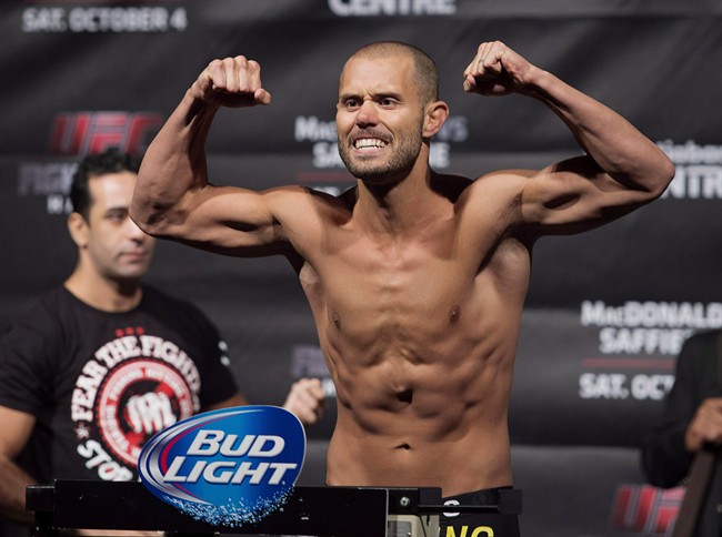 Chad Laprise from Montreal flexes at the UFC Fight Nights weigh-in in Halifax Friday, October 3, 2014. Canadian lightweight Chad (The Disciple) Laprise was pitted against Australian fighters during filming of