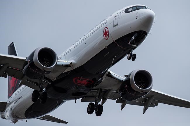 An Air Canada Boeing 737 Max aircraft arriving from Toronto prepares to land at Vancouver International Airport in Richmond, B.C., on Tuesday, March 12, 2019. Air Canada is cancelling an order for 11 Boeing 737 Max aircraft amid ongoing questions about the safety of the grounded jet. THE CANADIAN PRESS/Darryl Dyck