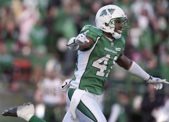 Saskatchewan Roughriders safety Tyron Brackenridge celebrates after a goal line stand against the Edmonton Eskimos during the second half of CFL football action in Regina, Sask., Saturday, October 12, 2013. Brackenridge announced his retirement Thursday, ending a pro career that included a five-season run with the Roughriders and a Grey Cup title in 2013. THE CANADIAN PRESS/Liam Richards