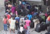 Asylum seekers line up to enter Olympic Stadium Friday, August 4, 2017 near Montreal. New figures from the federal government show 16,503 people were intercepted by the RCMP last year crossing between formal border points, likely to seek asylum in Canada. THE CANADIAN PRESS/Paul Chiasson