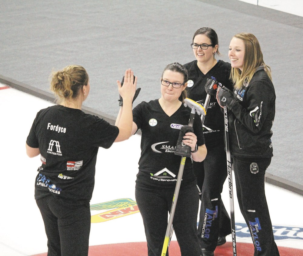 Lucas Punkari/The Brandon Sun
Alyssa Calvert's rink celebrates after their upset win over Darcy Robertson on Friday afternoon at the 2022 Manitoba Scotties Tournament of Hearts in Carberry.