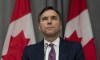 Minister of Finance Bill Morneau listens to a question during a news conference Friday May 1, 2020 in Ottawa. The federal government says it will provide loans and financing to the countries largest employers to help them weather the COVID-19 economic crisis. THE CANADIAN PRESS/Adrian Wyld