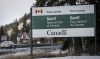 The Banff National Park entrance is shown as Parks Canada is restricting vehicles in the national parks and national historic sites in Banff, Alta., Tuesday, March 24, 2020. The federal environment minister says Canadians who have campground reservations in some national parks will be allowed to pitch their tents and pull in their trailers starting next week. THE CANADIAN PRESS/Jeff McIntosh
