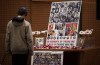 A man pauses to look at photographs of some of the people who died in the downing of Ukrainian Airlines Flight 752 in Iran, during a vigil for the victims of the flight at the Har El synagogue in West Vancouver on Sunday January 19, 2020. The families of Canadians killed by Iran's downing of a commercial airliner in January are preparing to grill Foreign Affairs Minister Francois-Philippe Champagne over the federal government's plan to hold the Islamic Republic to account. THE CANADIAN PRESS/Darryl Dyck