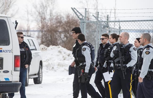 Randan Dakota Fontaine is led out of court in La Loche, Sask. on Friday, Feb.23, 2018 after a provincial court judge decided that he would be sentenced as an adult in the 2016 shooting spree that left four people dead and seven others wounded in La Loche. The Supreme Court of Canada will not hear an appeal from a young offender who was sentenced as an adult in a mass shooting at a northern Saskatchewan school.THE CANADIAN PRESS/Jason Franson
