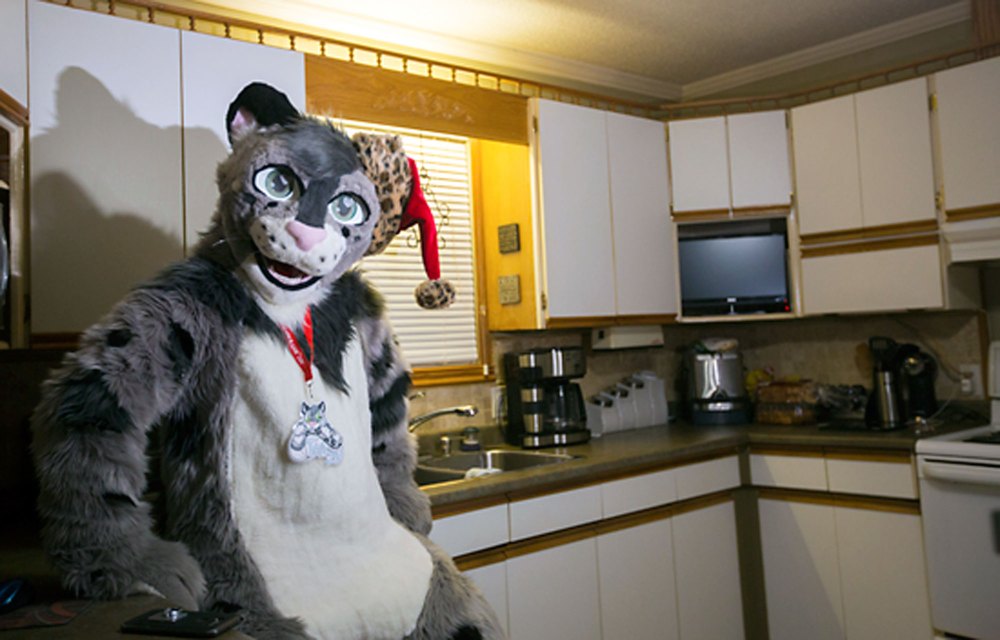 (Photos by Chelsea Kemp/The Brandon Sun)
Justin Zinger, aka Toasty the Avocado Snep snow leopard, chills in the kitchen on Nov. 14.
