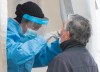 A health-care worker swabs a man at a walk-in COVID-19 test clinic in Montreal North, Sunday, May 10, 2020, as the COVID-19 pandemic continues in Canada and around the world. THE CANADIAN PRESS/Graham Hughes