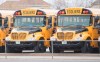 School buses are shown at a depot in Vaudreuil-Dorion, Que., west of Montreal, Sunday, May 10, 2020. Quebec schoolchildren will be entering a vastly changed environment this week when they head back to classrooms that have been closed since mid-March because of COVID-19. THE CANADIAN PRESS/Graham Hughes