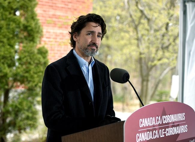 Prime Minister Justin Trudeau listens to a reporter's question during his daily news conference on the COVID-19 pandemic outside his residence at Rideau Cottage in Ottawa, on Saturday, May 9, 2020. THE CANADIAN PRESS/Justin Tang
