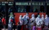 Passengers queue to get on a bus in the capital Addis Ababa, Ethiopia Friday, Nov. 6, 2020. Ethiopia's prime minister says airstrikes have been carried out against the forces of the country's Tigray region, asserting that the strikes in multiple locations 