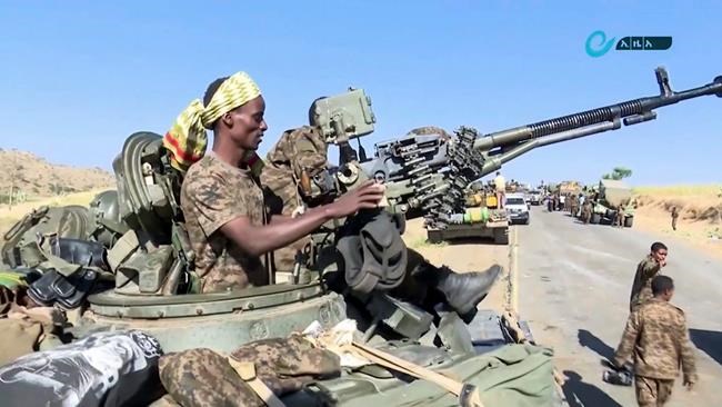 This image made from undated video released by the state-owned Ethiopian News Agency on Monday, Nov. 16, 2020 shows Ethiopian military in an armored personnel carrier, on a road in an area near the border of the Tigray and Amhara regions of Ethiopia. Ethiopia's prime minister Abiy Ahmed said in a social media post on Tuesday, Nov. 17, 2020 that