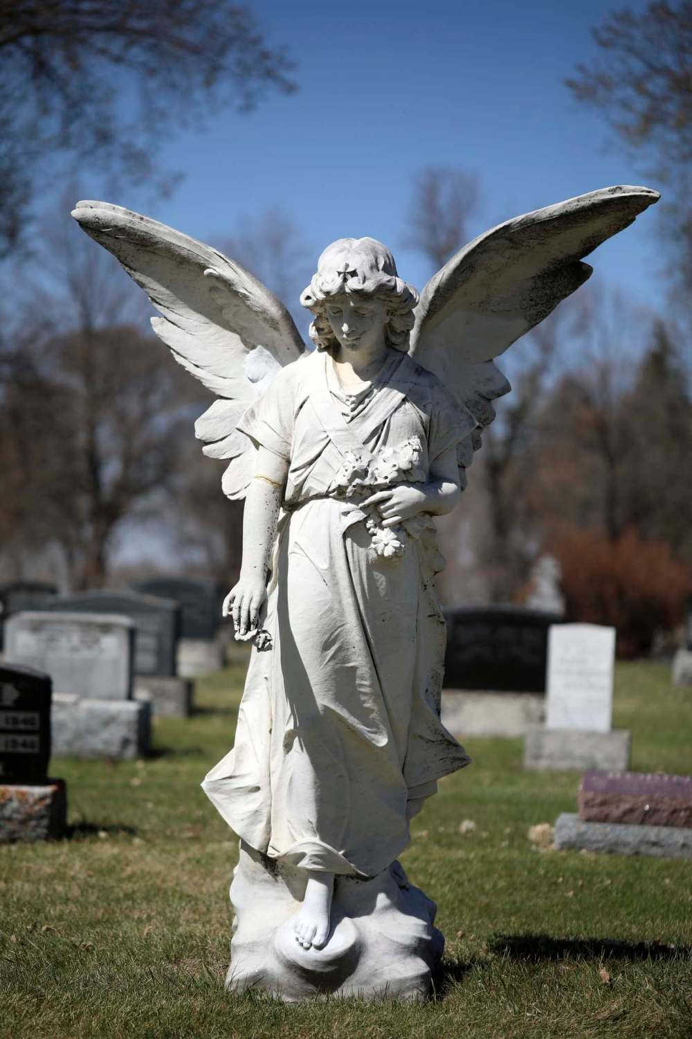 A stone angel in the Brandon Municipal Cemetery was vandalized recently. As of Tuesday, the vandalism had been covered up with matching paint by a good Samaritan. (Tim Smith/The Brandon Sun)