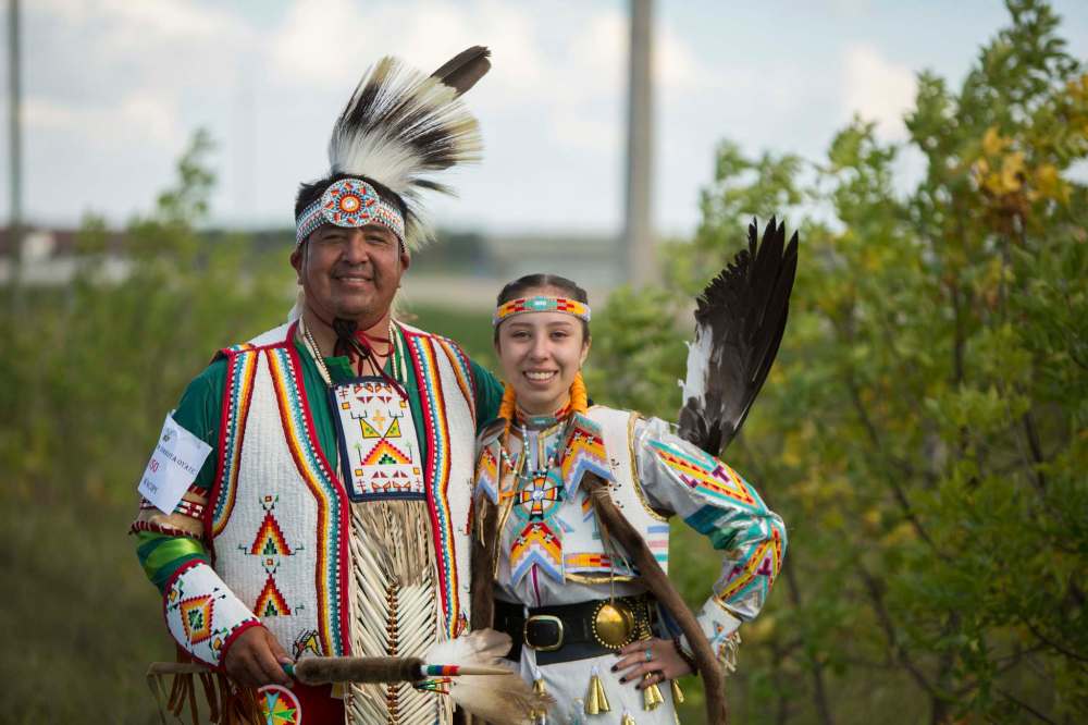 Dakota Plains First Nation member Don Smoke and his daughter Sophia attend the Canupawakpa Dakota Oyate One Day Contest Wacipi on Sept. 4.