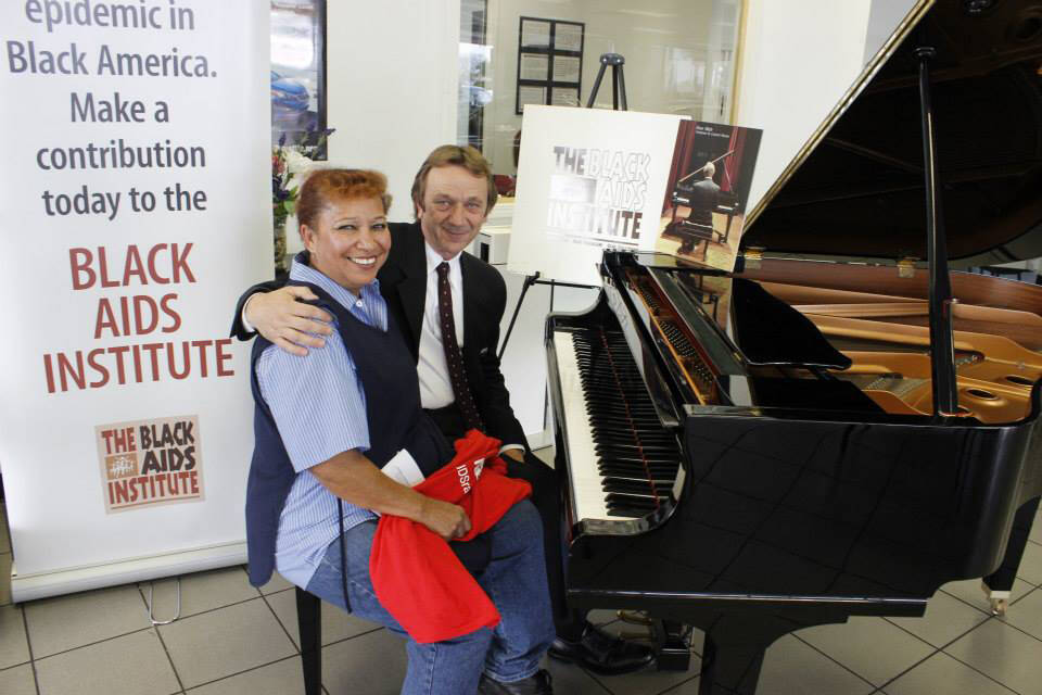 Submitted
Pianist Evan Wish poses for a photo with an attendee at a Black AIDS Institute fundraising event that took place in Los Angeles, Calif., in February 2014. Wish told the Sun that charity work has been a big part of his career since around 2010.