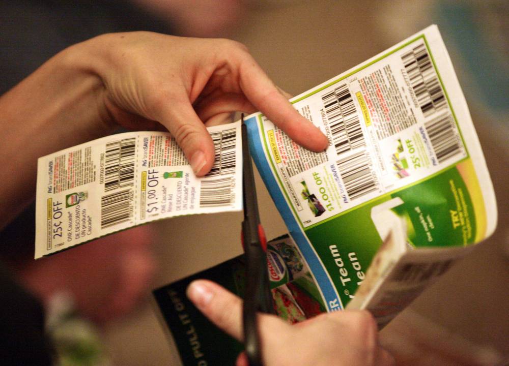 File
A woman clips coupons at a weekly get-together in Fresno, Calif. Sylvain Charlebois writes that while the coupon industry in the U.S. is highly sophisticated, promotions in Canada, including coupons, are incredibly difficult to find since the start of the pandemic.