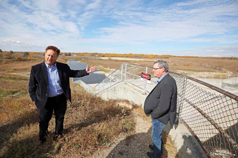06102020
Infrastructure Minister Ron Schuler and Riverdale Municipality Mayor Todd Gill check out the Rivers dam spillway after a press conference on Tuesday. (Tim Smith/The Brandon Sun)