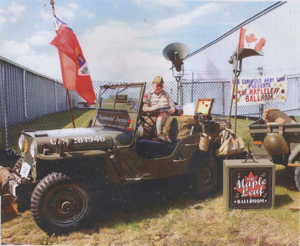 Ed James sets up a display to compliment his 1946 Willys CJ2A jeep during a 2019 Elkhorn show and shine event. (Submitted)