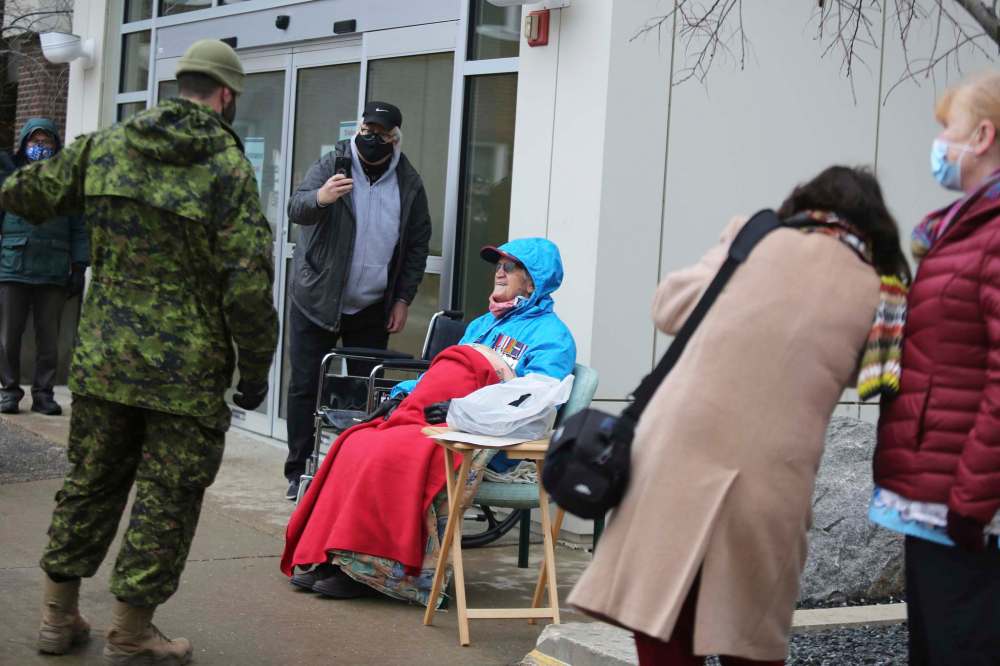 LEFT: Donald Thomson chats with members of CFB Shilo’s 1st Regiment Royal Canadian Horse Artillery at the Brandon Regional Health Centre on Friday morning. The Shilo representatives gave Thomson a military-themed hat, jacket and letter of commendation to help celebrate his upcoming 100th birthday. RIGHT: Members of CFB Shilo’s 1st Regiment Royal Canadian Horse Artillery drive towards the Brandon Regional Health Centre in their light armoured vehicles on Friday morning to help celebrate Donald Thomson’s upcoming 100th birthday. (Kyle Darbyson/The Brandon Sun)