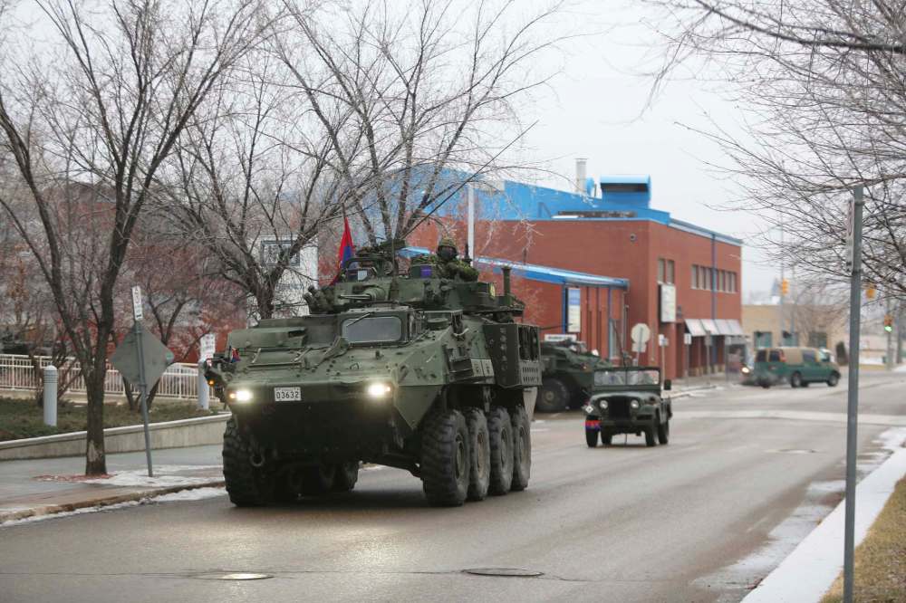 Members of CFB Shilo’s 1st Regiment Royal Canadian Horse Artillery drive towards the Brandon Regional Health Centre in their light armoured vehicles on Friday morning to help celebrate Donald Thomson’s upcoming 100th birthday. (Kyle Darbyson/The Brandon Sun)