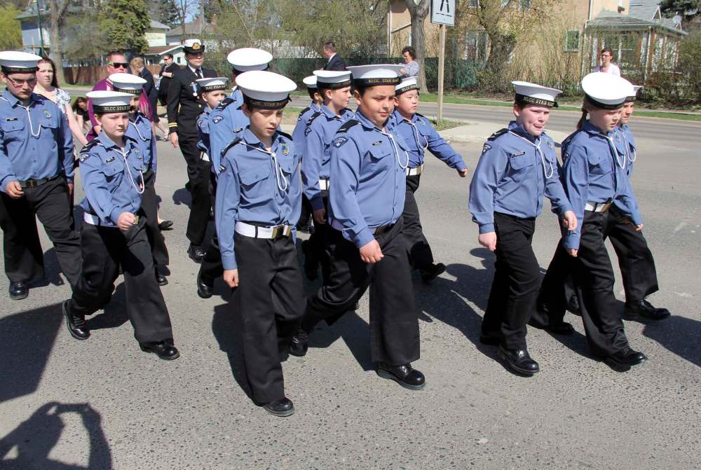 LEFT: Youngsters with the Navy League Cadet Corps #4 Stan Hawitt march on Victoria Avenue as part of the annual Battle of Atlantic parade a few years ago. (File) RIGHT: Mayor Rick Chrest, sitting, signs a proclamation for the 125th anniversary of the navy league in Canada late last year. Also pictured is, from left, is acting sub-Lt. Amanda Slashinsky, Cdr. Clayton Kozak, acting sub-Lieut. Charlene Fontaine and acting sub-Lieut. Melissa Slashinsky. (Submitted)