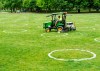 A worker paints environmentally friendly physical distancing circles at Trinity Bellwoods Park during the COVID-19 pandemic in Toronto on Thursday, May 28, 2020. THE CANADIAN PRESS/Nathan Denette