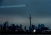 The Canadian Snowbirds circle the CN Tower as part of Operation Inspiration during the COVID-19 pandemic in Toronto on Sunday, May 10, 2020. THE CANADIAN PRESS/Nathan Denette