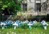 A man looks out the window at the Camilla Care Community centre overlooking crosses marking the deaths of multiple people that occured during the COVID-19 pandemic in Mississauga, Ont., on Tuesday, May 26, 2020. THE CANADIAN PRESS/Nathan Denette