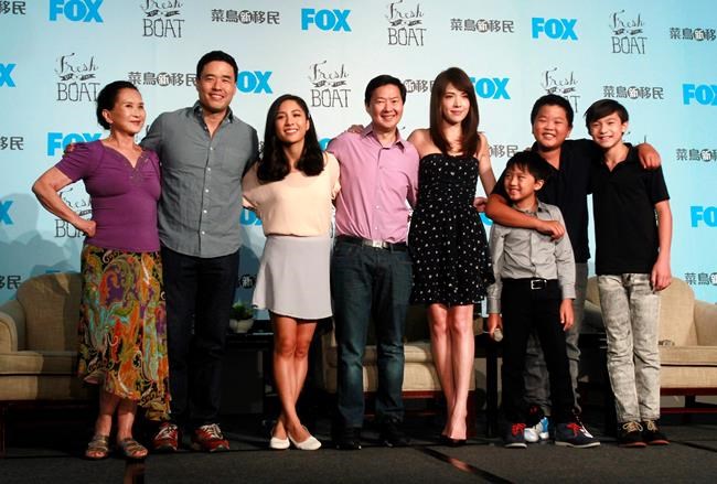 FILE - In this Friday, Aug. 5, 2016 file photo, actors, from left, Lucille Soong, Randall Park, Constance Wu, Ken Jeong, Ann Hsu, Ian Chen, Hudson Yang and Forrest Wheeler pose for photographers during a media event promoting their television comedy series