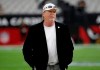 FILE - In this Aug. 15, 2019, file photo, Raiders owner Mark Clark Davis stands on the field before the team's NFL football game against the Arizona Cardinals in Glendale, Ariz. The Las Vegas Raiders got angry backlash for a tweet the team sent after Minneapolis police officer Derek Chauvin was convicted of murdering George Floyd. Davis said he was driving the verdict was announced and heard Floyd's brother, Philonise, make the statement that “we can all breathe again” and decided to make that message the team's response. (AP Photo/Rick Scuteri, File)