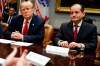 FILE - In this Sept. 17, 2018, file photo, President Donald Trump, left, and Labor Secretary Alexander Acosta listen during a meeting of the President's National Council of the American Worker in the Roosevelt Room of the White House in Washington. The arrest of billionaire financier Jeffrey Epstein on child sex trafficking charges is raising new questions about the future of Acosta as well as Epstein’s relationships with several major political figures, including President Donald Trump and former President Bill Clinton. (AP Photo/Evan Vucci, File)