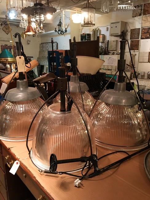 This Oct. 15, 2019 photo shows salvaged light fixtures available for sale at Olde Good Things salvage store in New York. Two of the hottest trends in home decor are sustainability and authenticity.