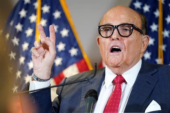 FILE - Former Mayor of New York Rudy Giuliani, a lawyer for President Donald Trump, speaks during a news conference at the Republican National Committee headquarters, Thursday Nov. 19, 2020, in Washington. President Donald Trump says his personal attorney Rudy Giuliani has tested positive for coronavirus. The president on Sunday, Dec. 6, 2020 confirmed in a tweet that Giuliani had tested positive for the virus. Giuliani has traveled extensively to battleground states in effort to help Trump subvert his election loss. (AP Photo/Jacquelyn Martin, file)