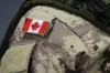 A Canadian flag patch sits is shown on the shoulder of a member of the Canadian Armed Forces in Trenton, Ont., on Thursday, Oct. 16, 2014. The Canadian Armed Forces is deploying military trainers back to Ukraine as it looks to restart some of the many missions and exercises temporarily suspended or scaled back because of COVID-19. THE CANADIAN PRESS/Lars Hagberg