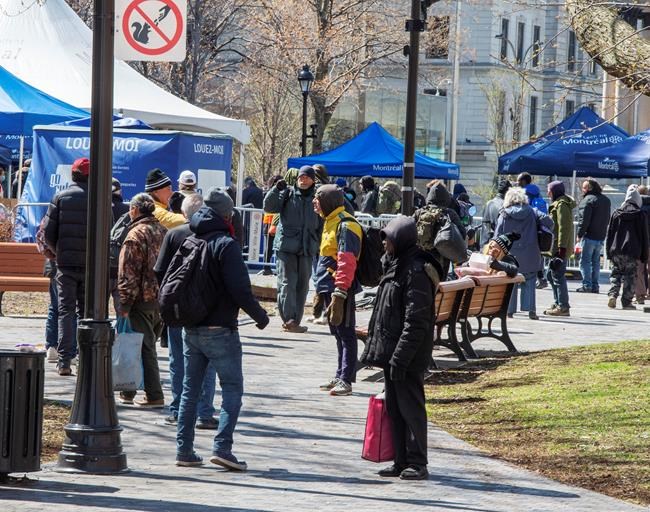 People line up for food at a day centre for the homeless Friday, May 8, 2020 in Montreal.THE CANADIAN PRESS/Ryan Remiorz