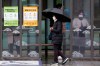 A woman wearing face mask passes by posters about precautions against new coronavirus at a bus station in Seoul, South Korea, Tuesday, Feb. 25, 2020. China and South Korea on Tuesday reported more cases of a new viral illness that has been concentrated in North Asia but is causing global worry as clusters grow in the Middle East and Europe. (AP Photo/Ahn Young-joon)